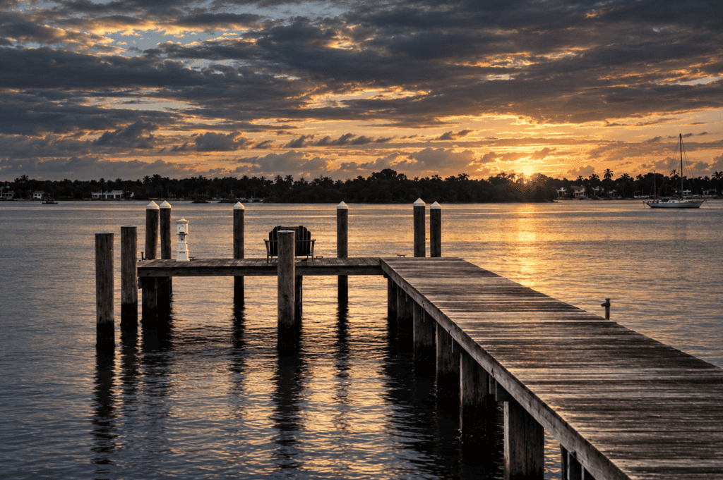 Pier 1893 Sunset Dock View Sunset over Pier 1893 with calm water and cloudy sky.